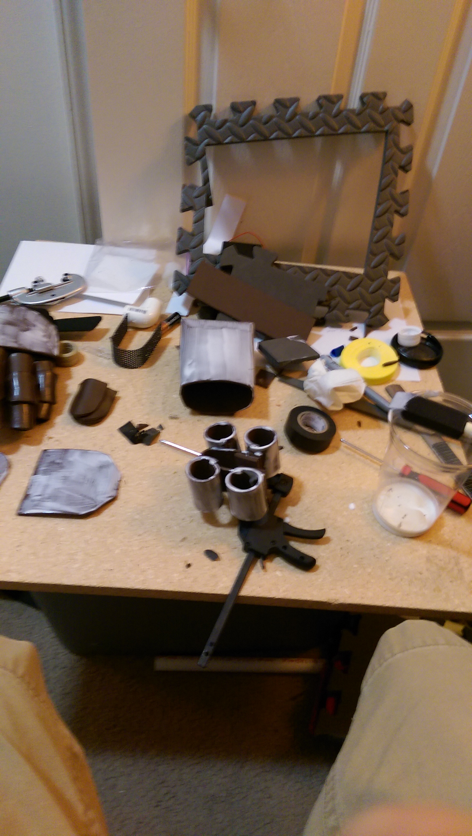 Potion holder and shoulder piece getting Podge-d. Brown foam and Mod Podge makes a really cool leather effect